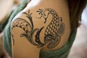Значение татуировок на теле: бабочка VS скорпион